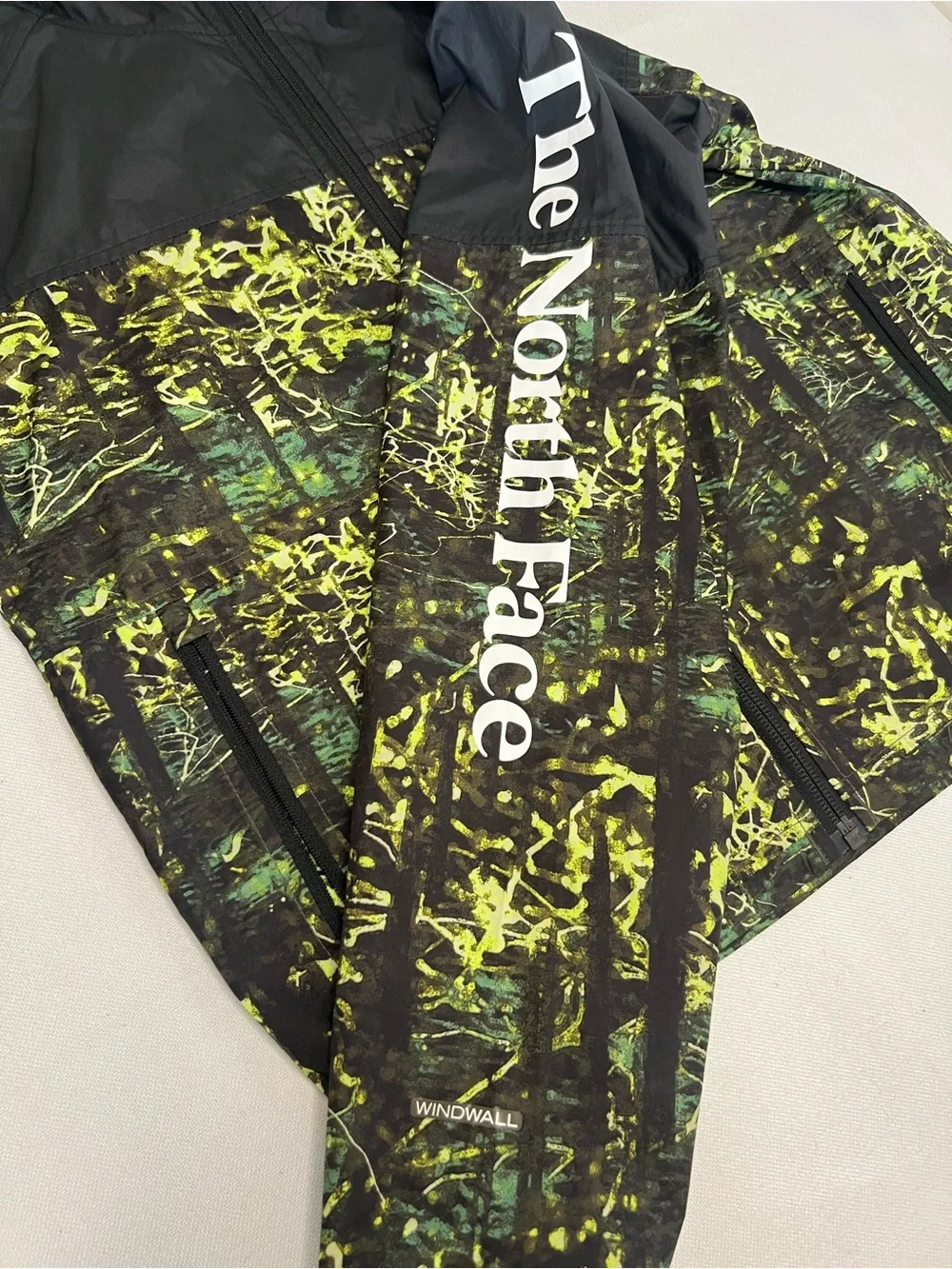 The North Face Kids Black Hooded Rain Jacket with Neon Green Print